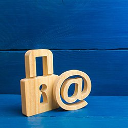 Blue background with a wooden lock and aroba